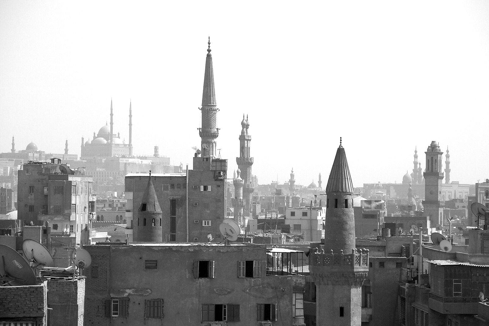 The minarets of Islamic Cairo layered into the haze above the rooftops